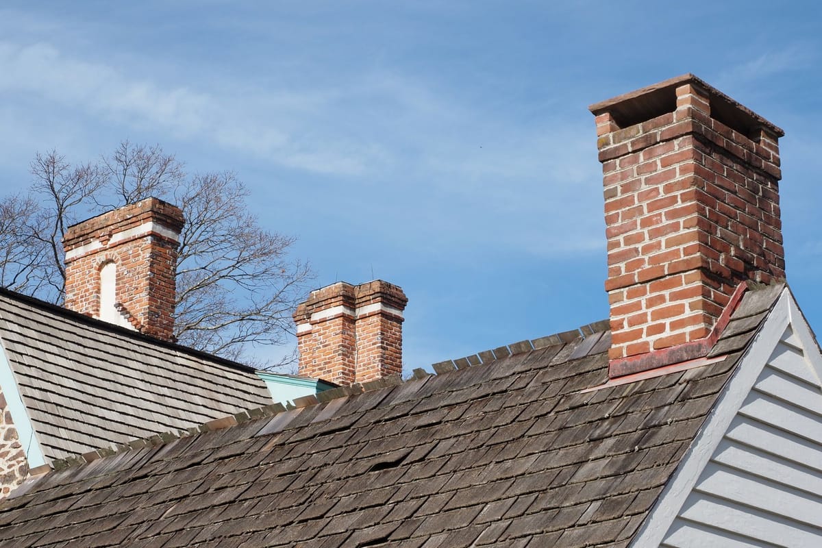 Brick chimneys on a tiled rooftop